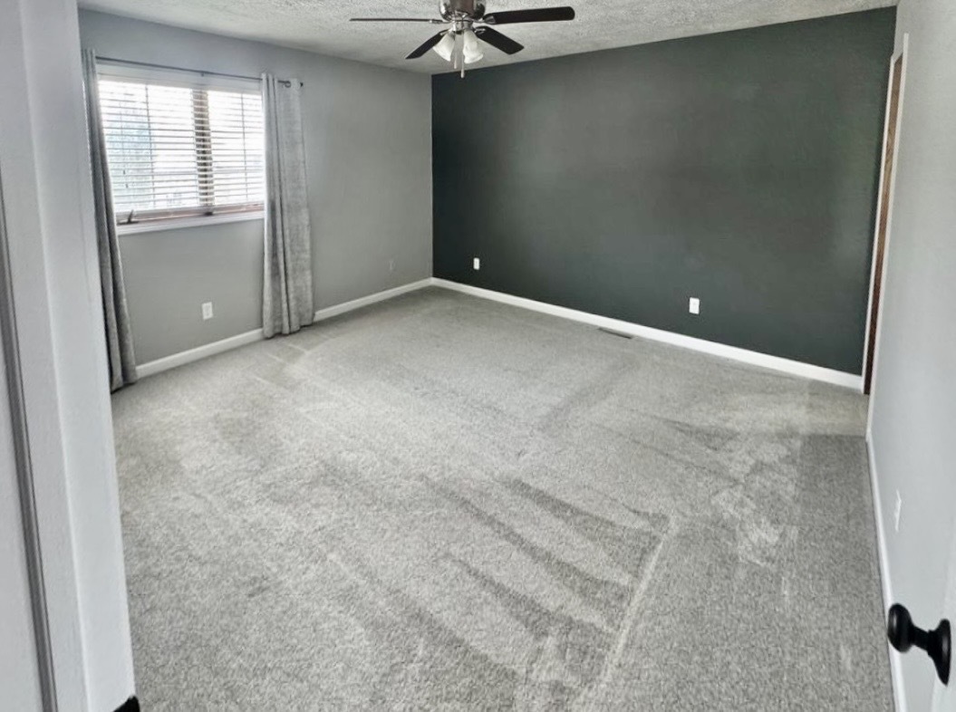 117 Colchester Drive Normal, IL 61761 - Photo 20 of 32 an empty room with windows and fan