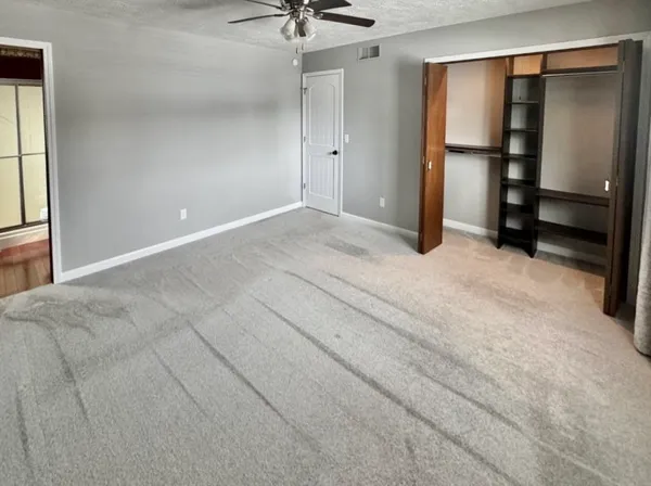 a view of an empty room with a window