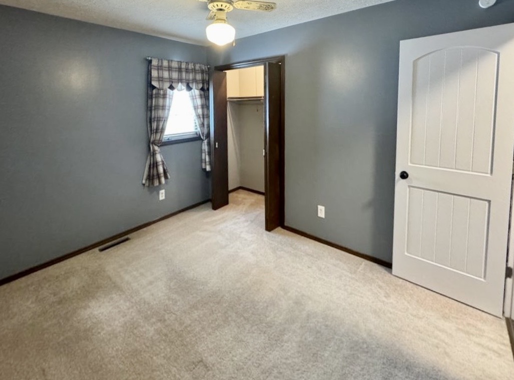 117 Colchester Drive Normal, IL 61761 - Photo 26 of 32 an empty room with windows and closet