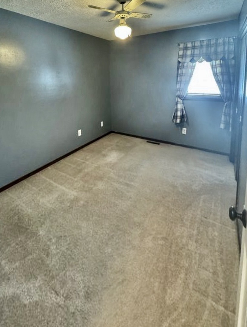 117 Colchester Drive Normal, IL 61761 - Photo 27 of 32 a view of an empty room with a window