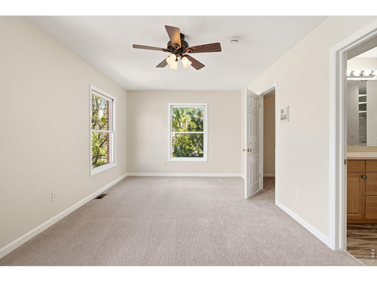 944 Ivanhoe Street Denver, CO 80220 - Photo 23 of 47 a view of an empty room with a window