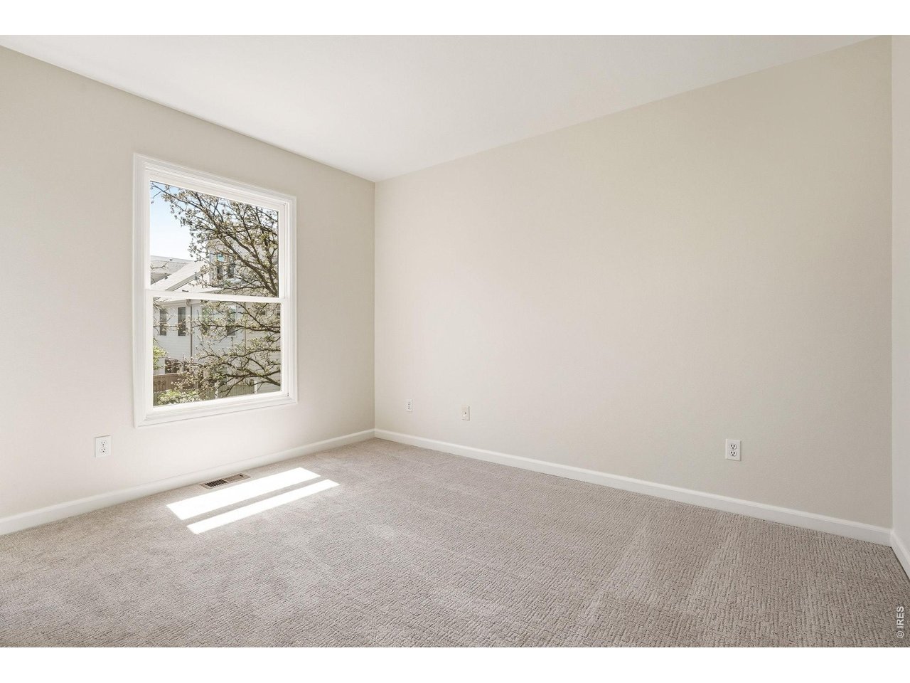 944 Ivanhoe Street Denver, CO 80220 - Photo 27 of 47 a view of an empty room with a window