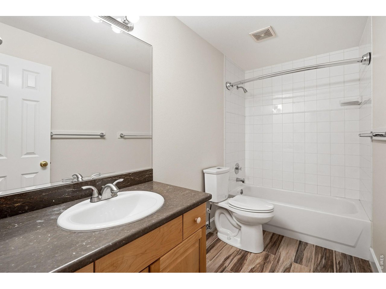 944 Ivanhoe Street Denver, CO 80220 - Photo 39 of 47 a bathroom with a sink toilet a mirror and shower