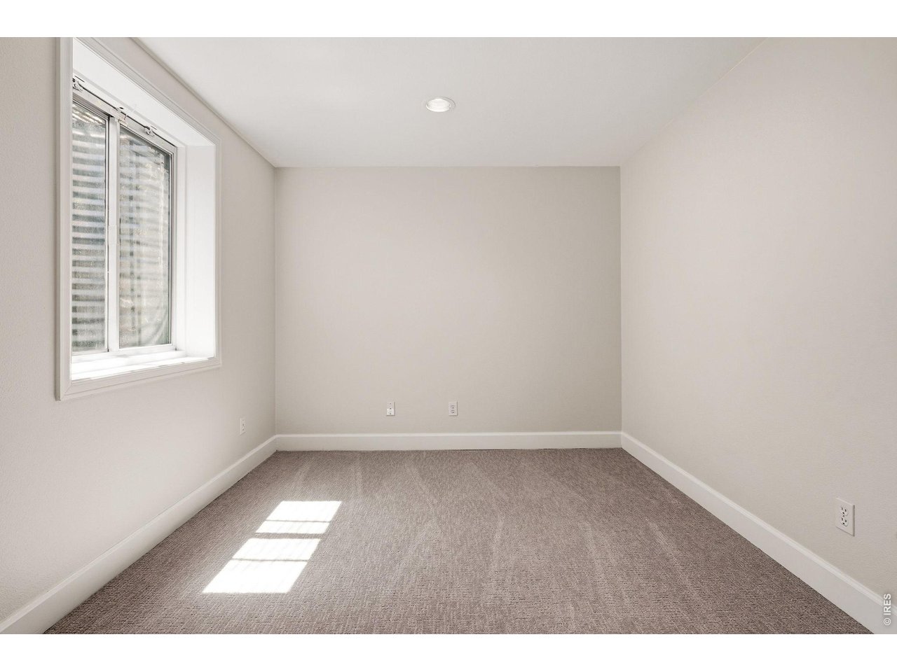 944 Ivanhoe Street Denver, CO 80220 - Photo 40 of 47 a view of an empty room with a window