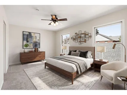 a bedroom with a bed and window