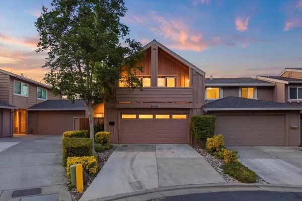 a front view of a house with outdoor space