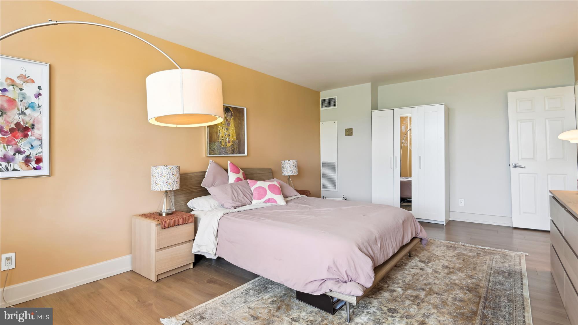 5101 River Road, Unit 602 Bethesda, MD 20816 - Photo 11 of 35 a bedroom with a bed and a mirror