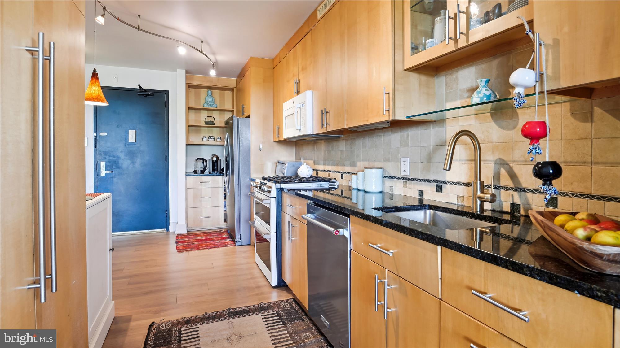 5101 River Road, Unit 602 Bethesda, MD 20816 - Photo 4 of 35 a kitchen with stainless steel appliances granite countertop a sink and cabinets