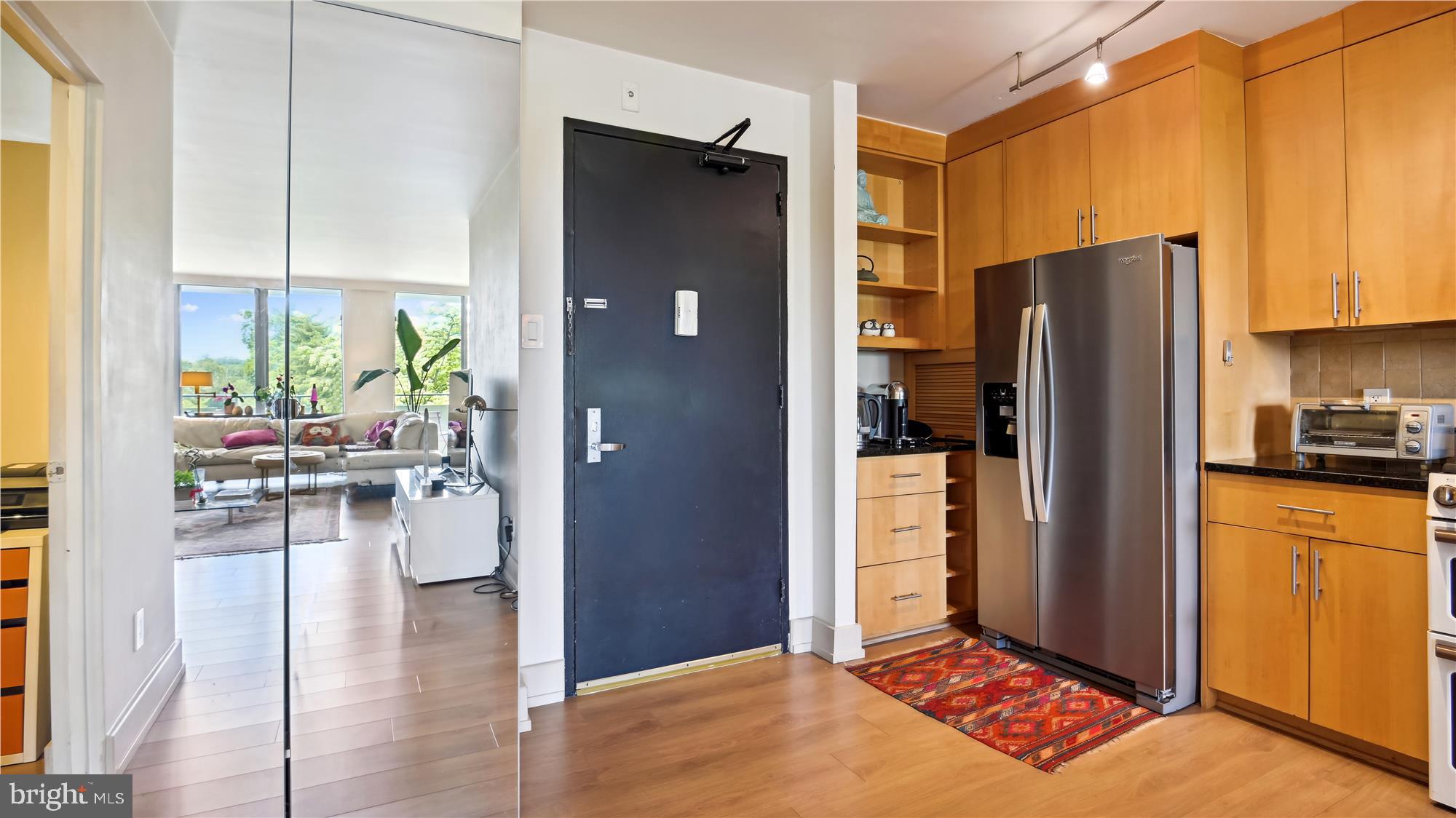 5101 River Road, Unit 602 Bethesda, MD 20816 - Photo 6 of 35 a kitchen with stainless steel appliances granite countertop a refrigerator and a stove