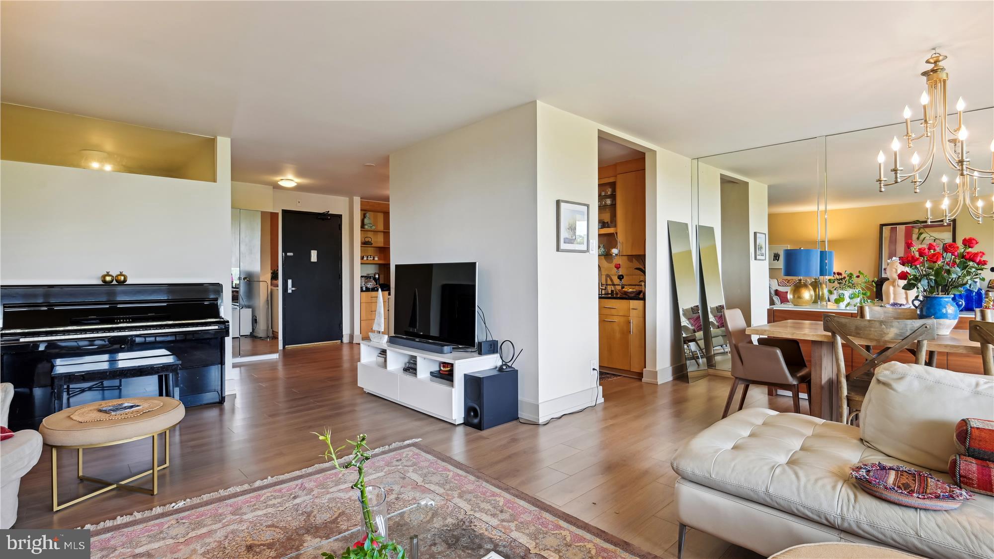 5101 River Road, Unit 602 Bethesda, MD 20816 - Photo 7 of 35 a living room with furniture and a flat screen tv