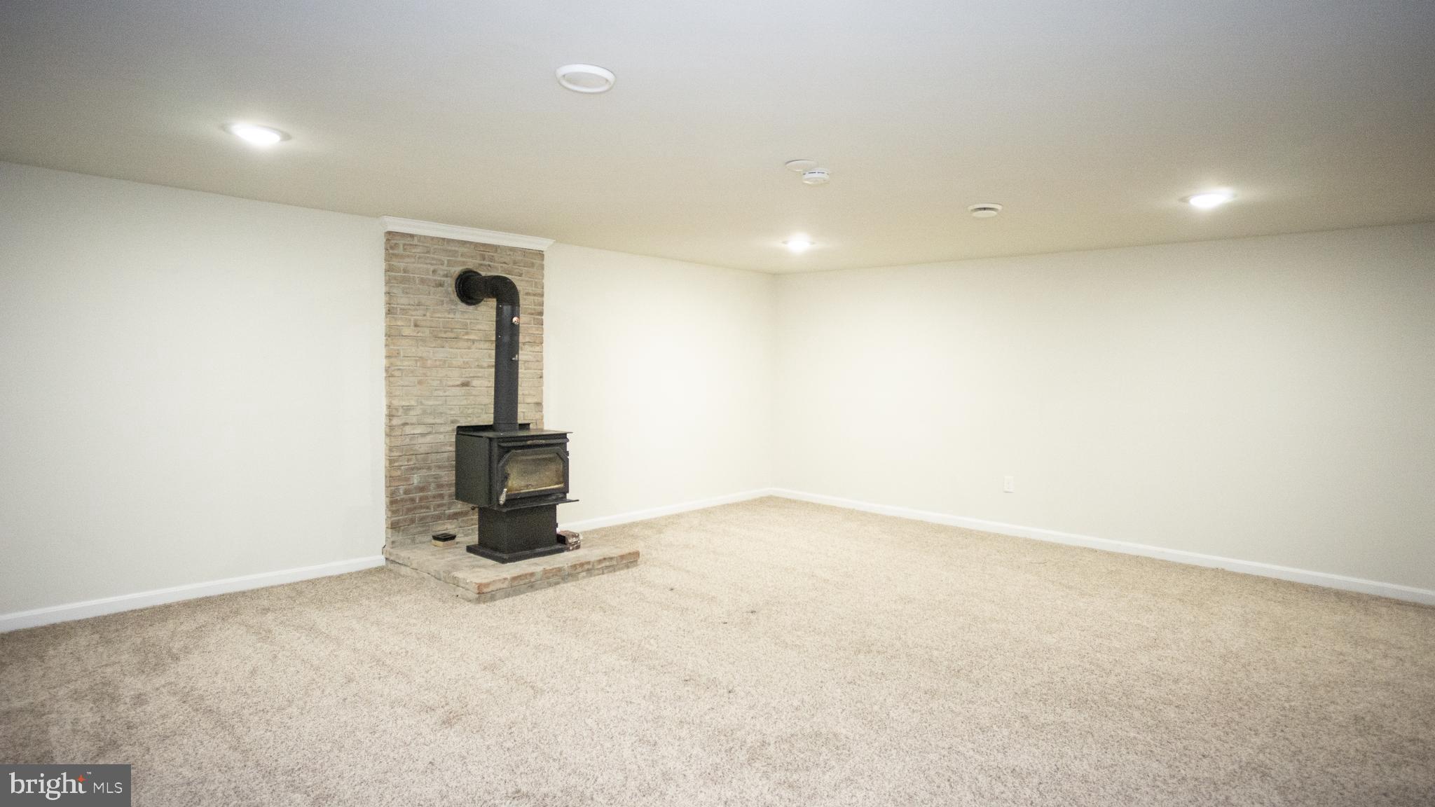 1197 Town Point Road Chesapeake City, MD 21915 - Photo 11 of 29 Family Room with wood stove