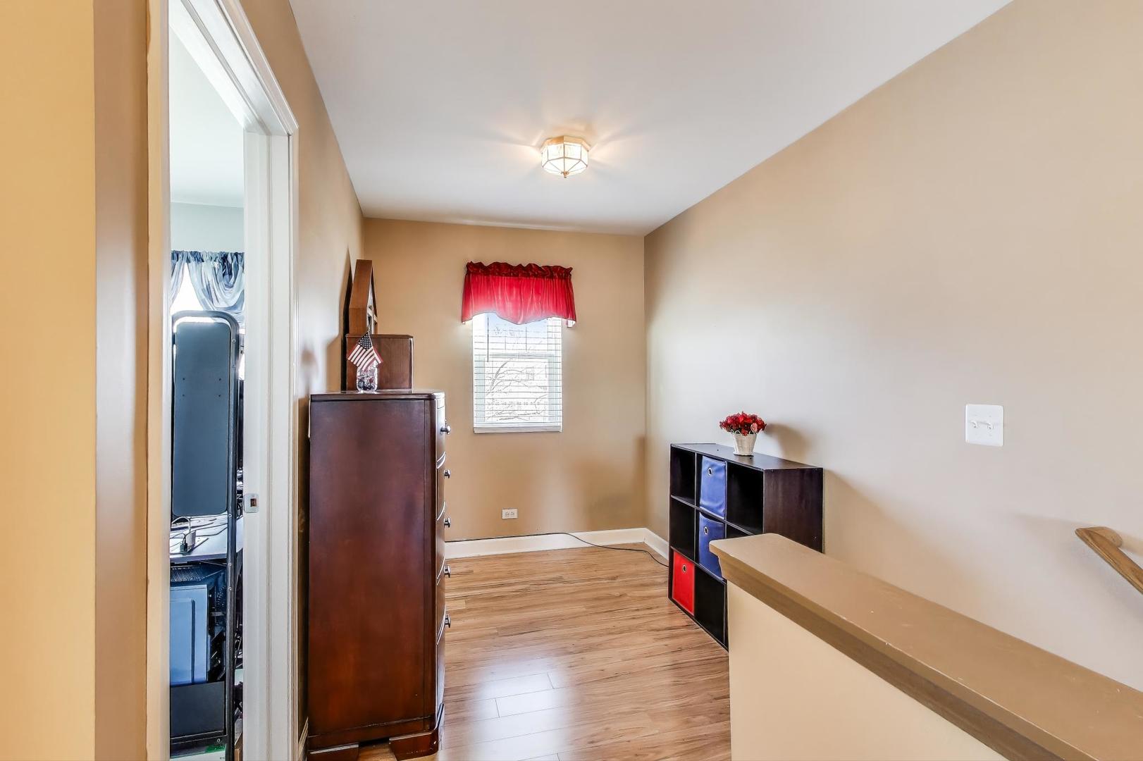 2005 Limestone Lane Carpentersville, IL 60110 - Photo 14 of 23 a room with furniture and wooden floor