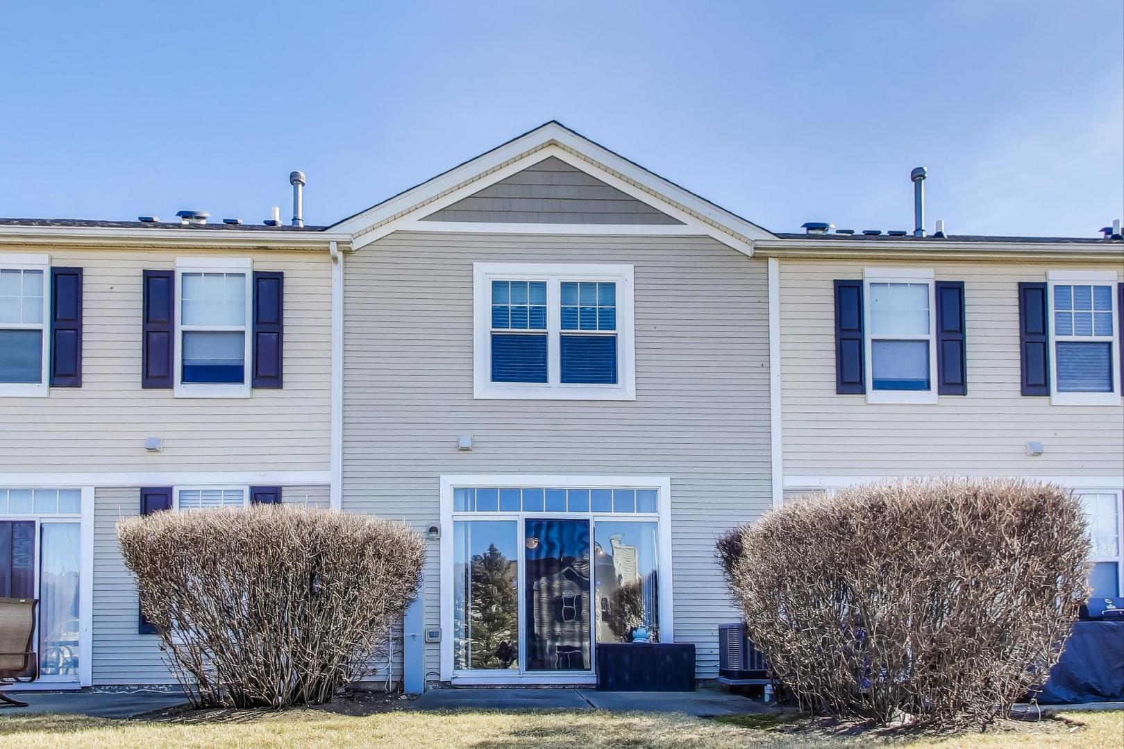 2005 Limestone Lane Carpentersville, IL 60110 - Photo 17 of 23 a front view of a house with garden