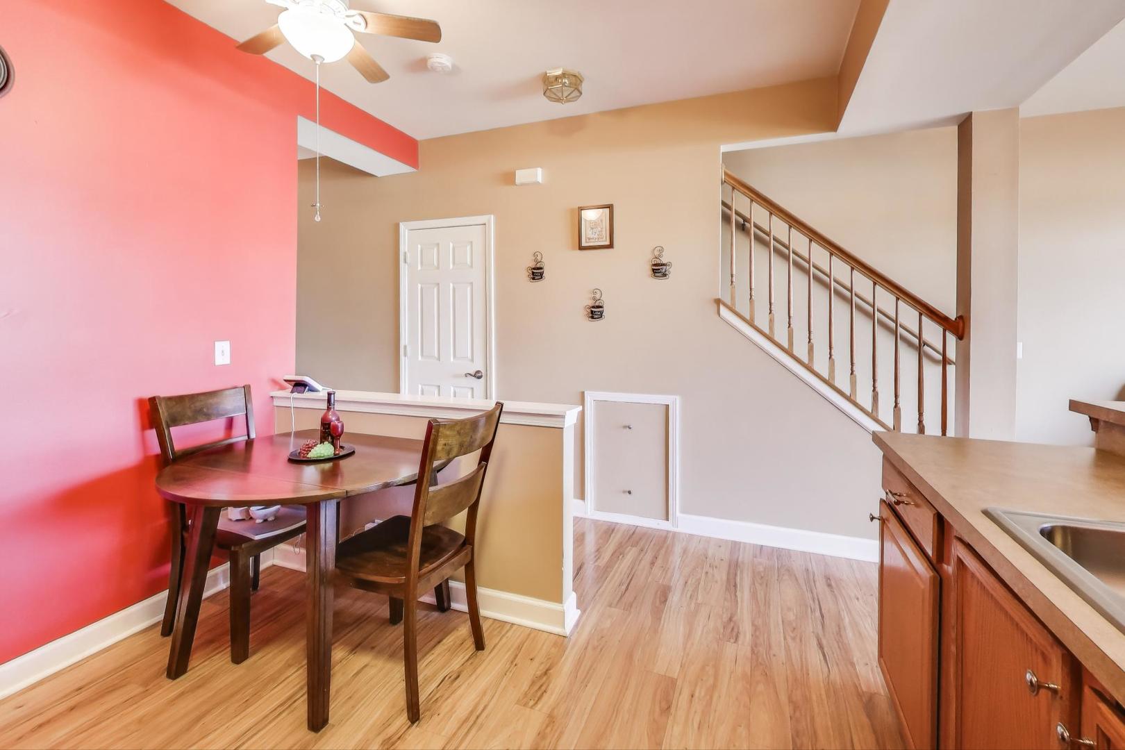 2005 Limestone Lane Carpentersville, IL 60110 - Photo 8 of 23 a view of a dining room with furniture and wooden floor