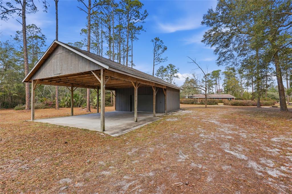 129 Southwest Benz Way Lake City, FL 32024 - Photo 23 of 30 a house with trees in the background