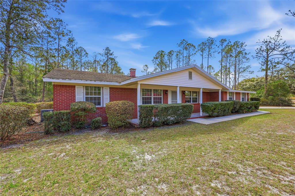 129 Southwest Benz Way Lake City, FL 32024 - Photo 25 of 30 a front view of a house with garden