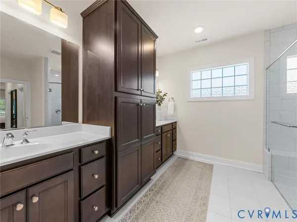 a kitchen with granite countertop a refrigerator and cabinets