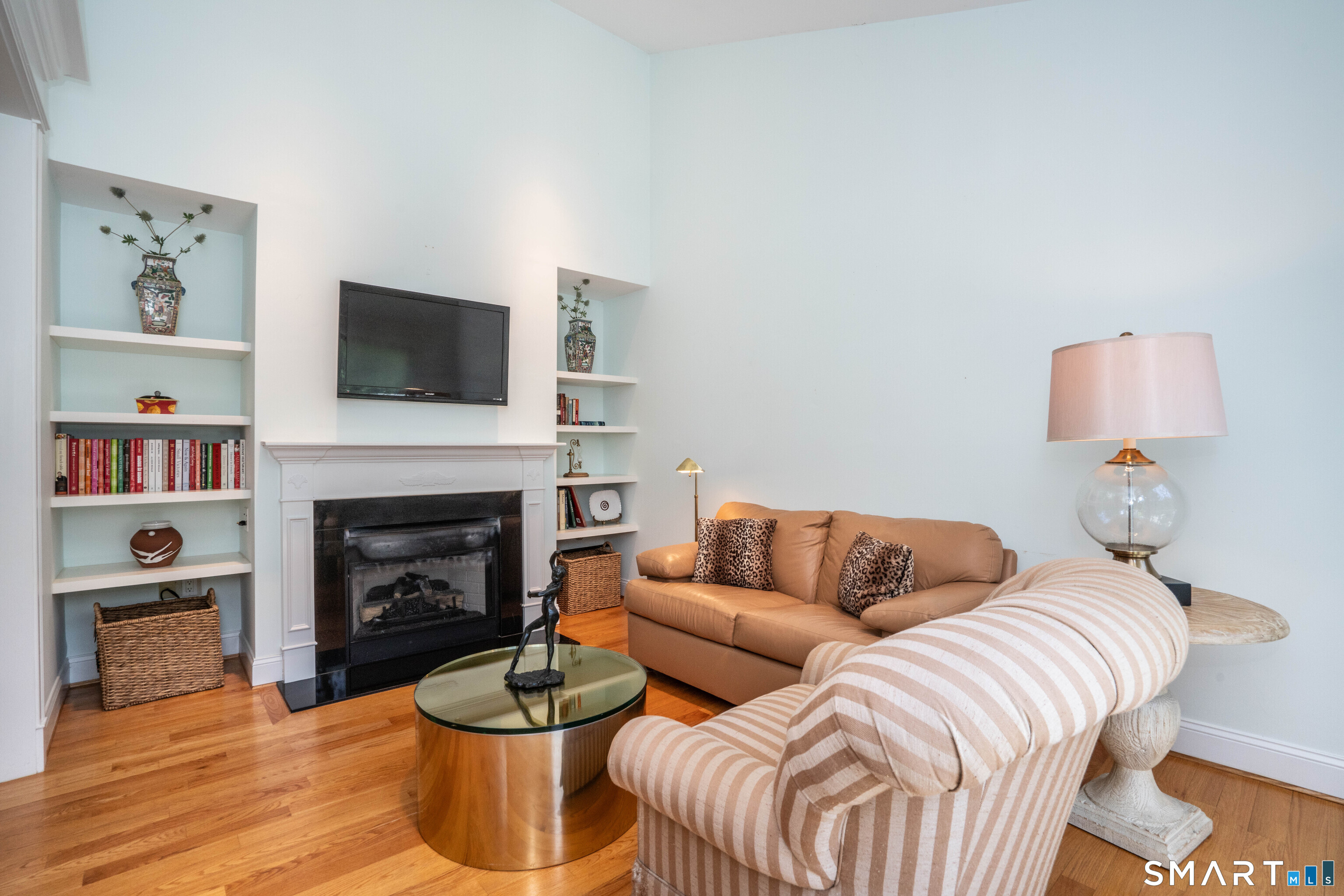 3 Morgan Place, Unit 3 Avon, CT 06001 - Photo 12 of 29 a living room with furniture fireplace and a flat screen tv