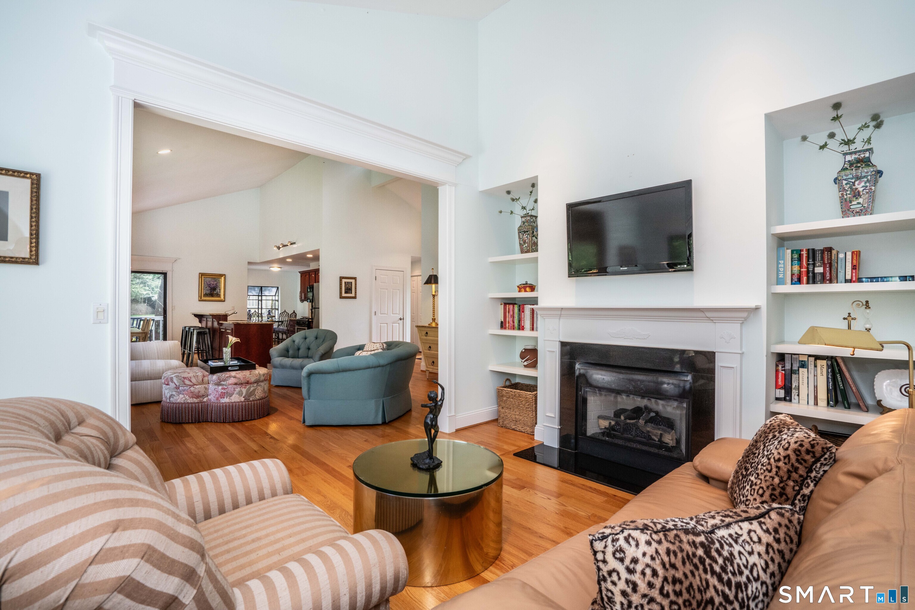 3 Morgan Place, Unit 3 Avon, CT 06001 - Photo 14 of 29 a living room with furniture a flat screen tv and a fireplace