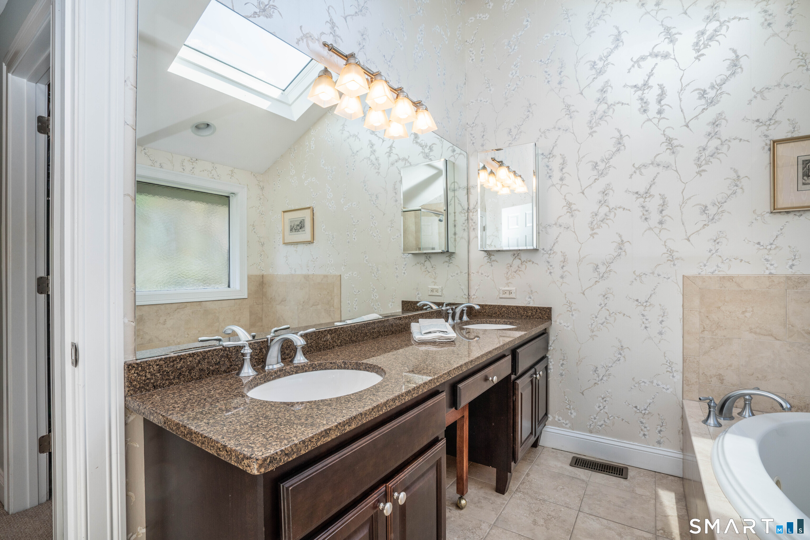 3 Morgan Place, Unit 3 Avon, CT 06001 - Photo 20 of 29 a bathroom with a granite countertop sink and a mirror