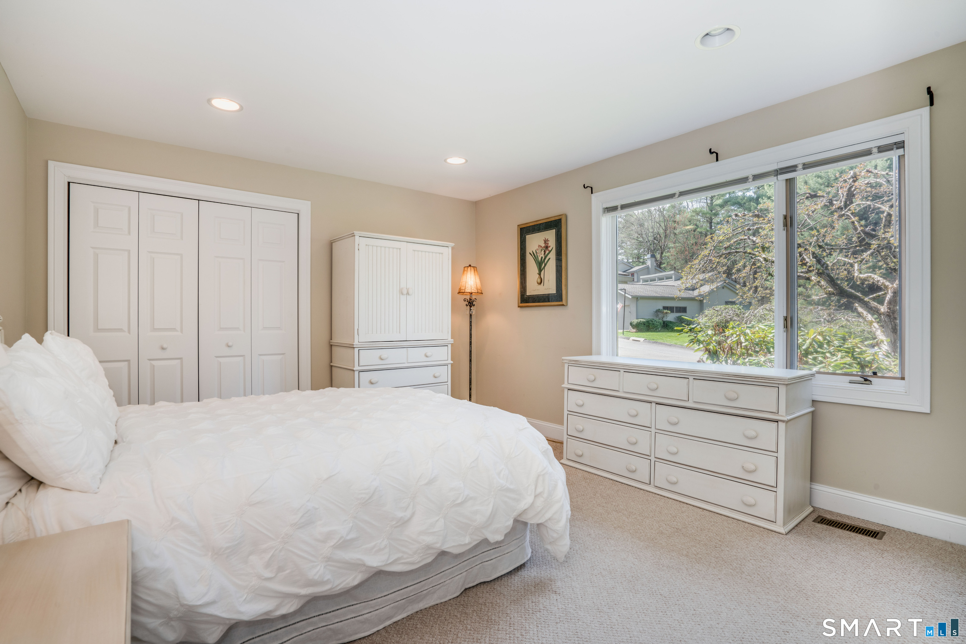 3 Morgan Place, Unit 3 Avon, CT 06001 - Photo 22 of 29 a bedroom with a large bed and a large window