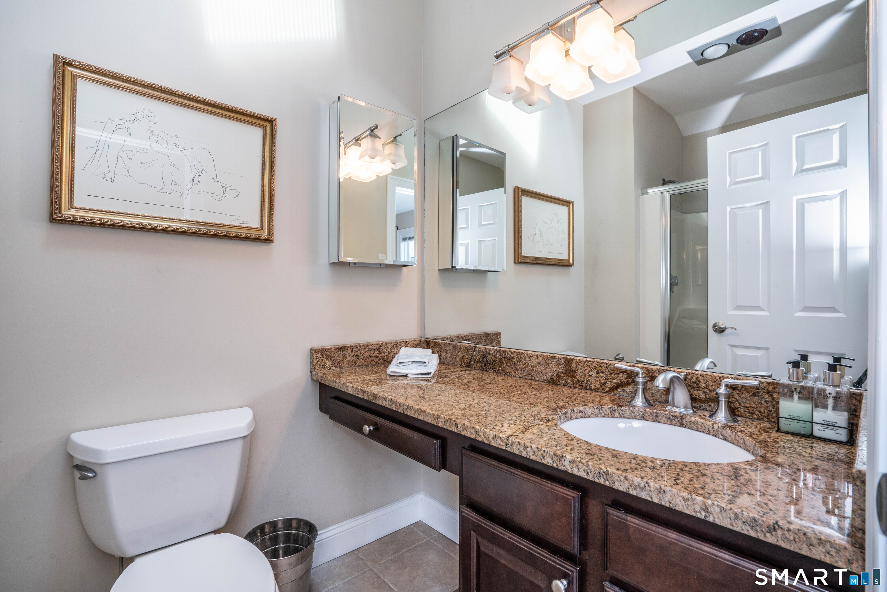 3 Morgan Place, Unit 3 Avon, CT 06001 - Photo 23 of 29 a bathroom with a granite countertop toilet sink and mirror