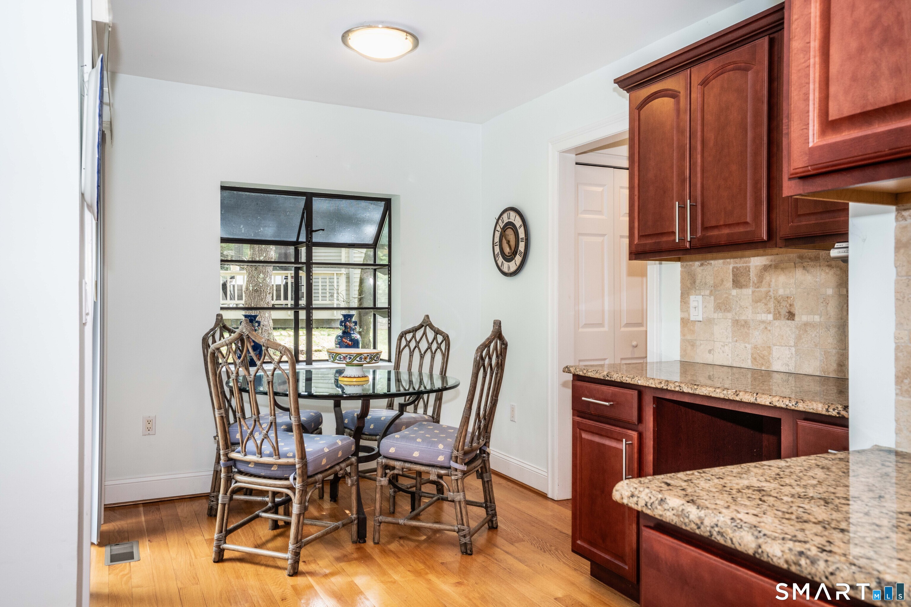 3 Morgan Place, Unit 3 Avon, CT 06001 - Photo 10 of 29 a view of a kitchen area with furniture and wooden floor