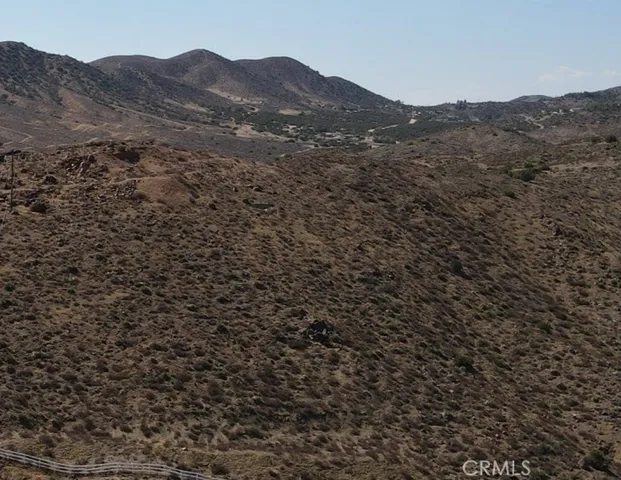 a view of a large mountains in a field