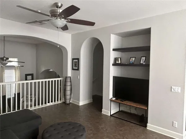 a view of livingroom with furniture and a flat screen tv