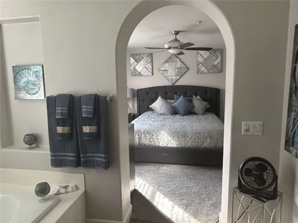 a bathroom with a bathtub and shower