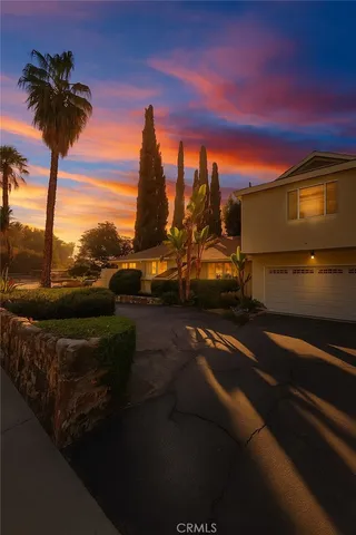 a view of a ocean with a floor to ceiling window next to a yard
