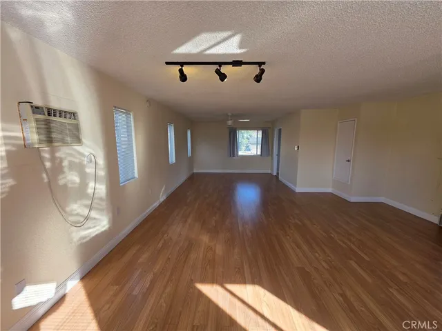 a kitchen with stainless steel appliances a refrigerator sink and cabinets