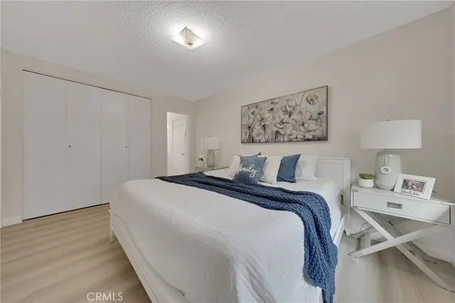 a bed room with a bed and a night stand