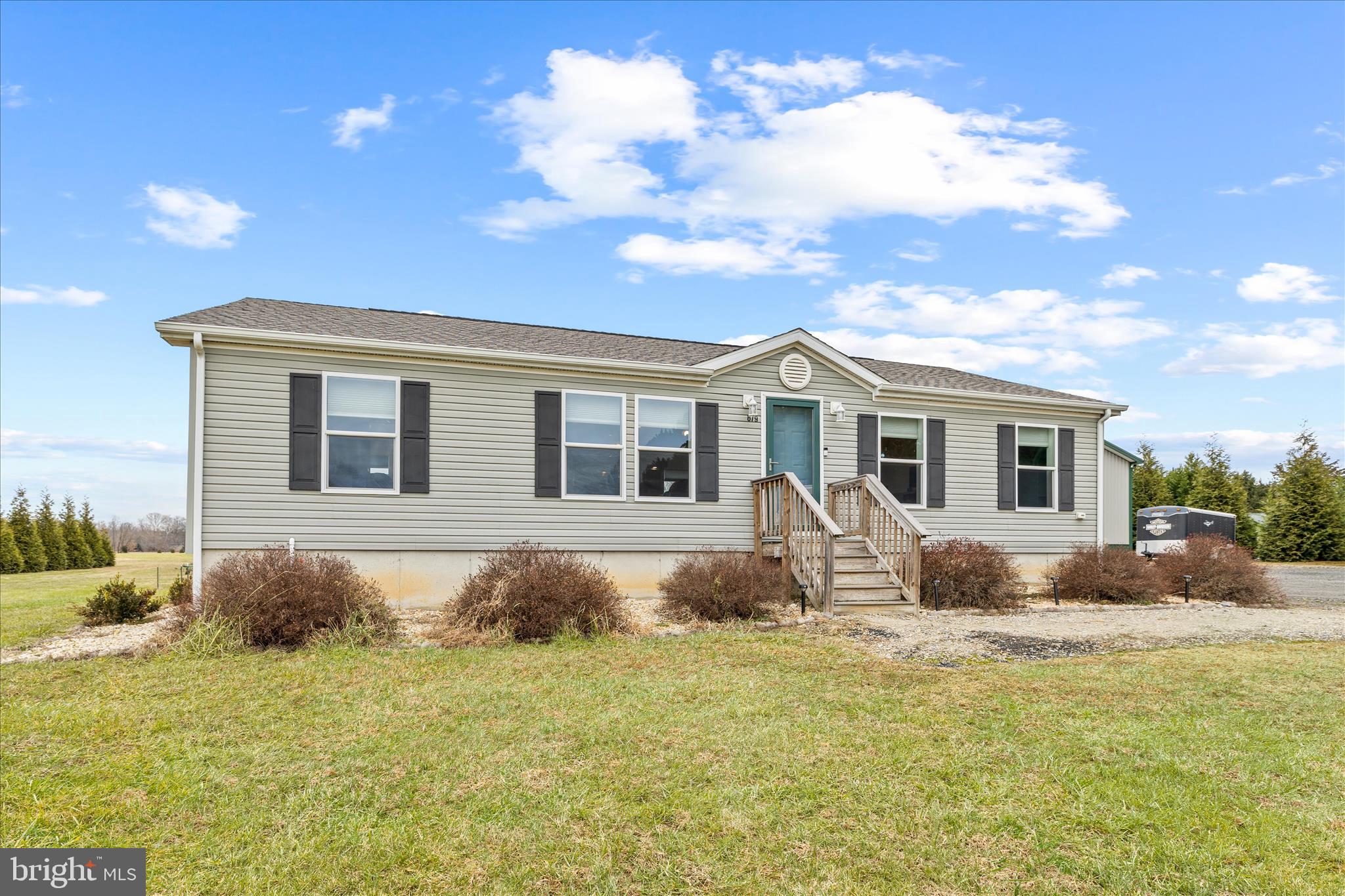 679 Oak Hill School Road Townsend, DE 19734 - Photo 2 of 50 a front view of a house with yard