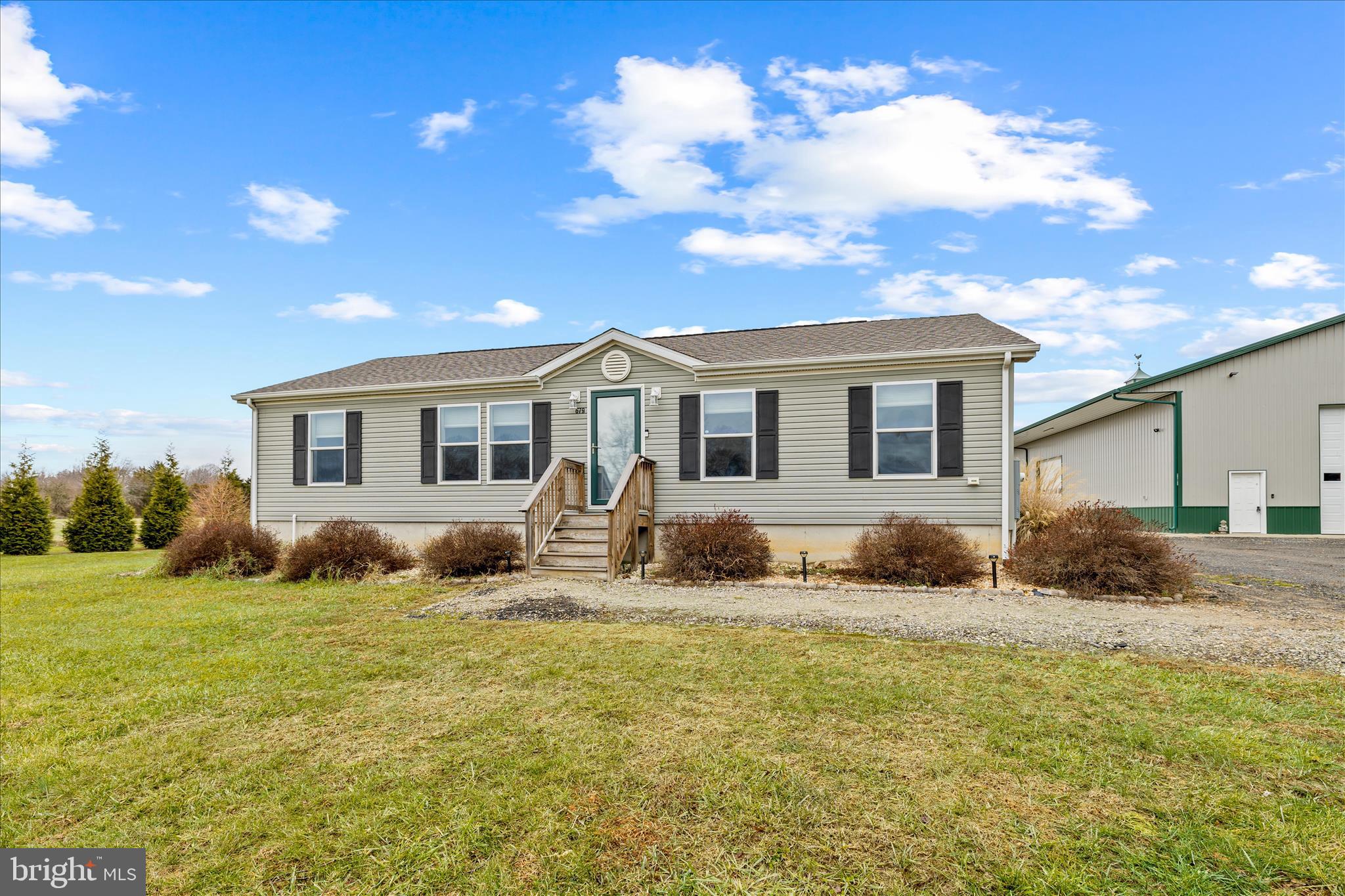 679 Oak Hill School Road Townsend, DE 19734 - Photo 3 of 50 a backyard of a house with table and chairs
