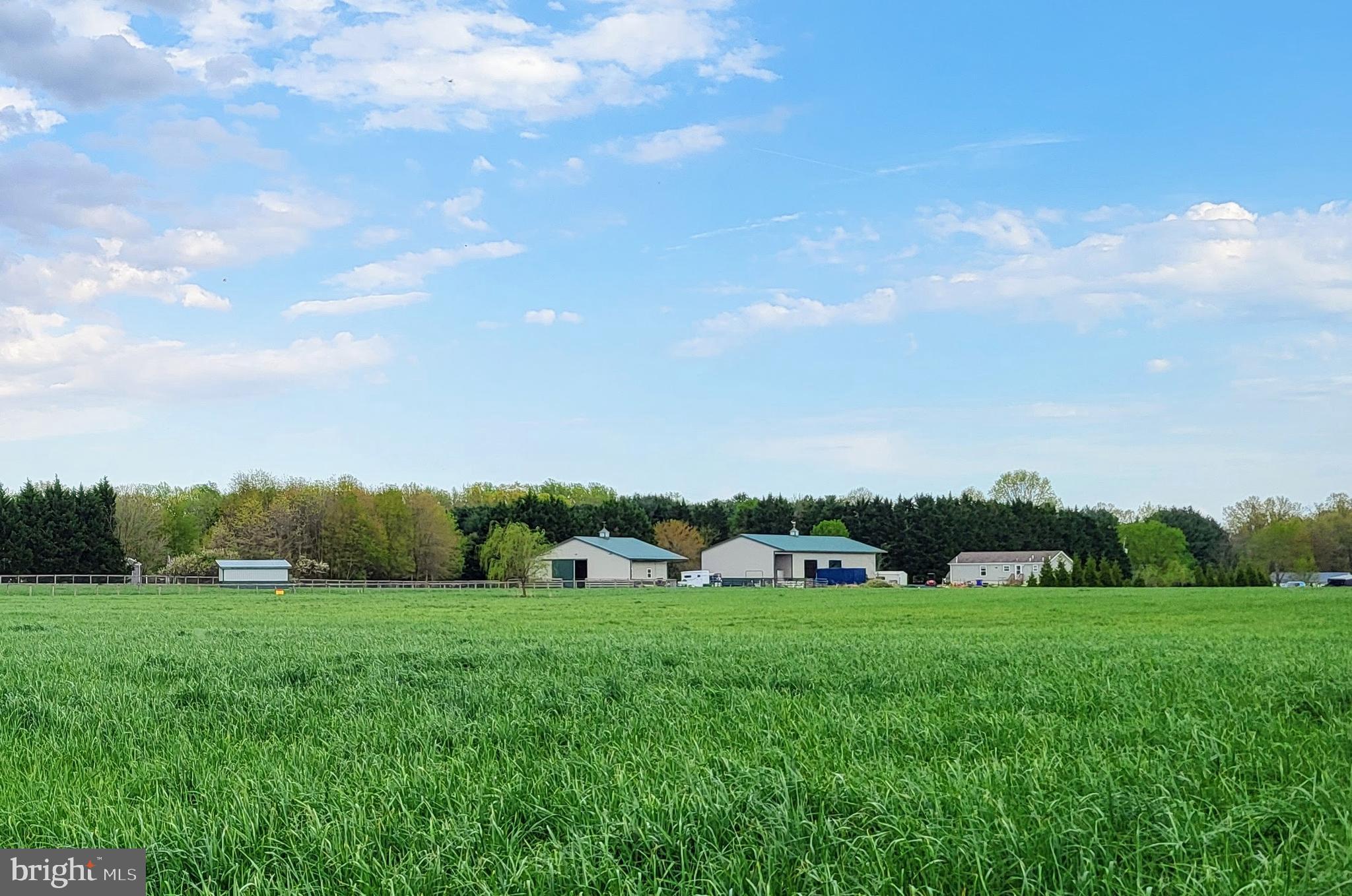 679 Oak Hill School Road Townsend, DE 19734 - Photo 50 of 50 a view of green field with house in the background