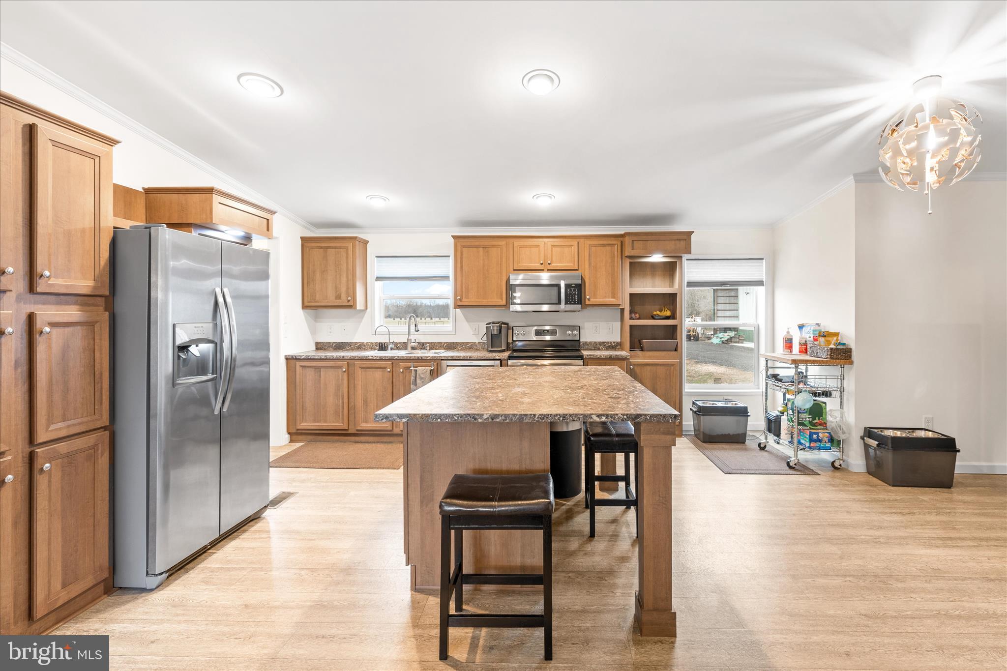 679 Oak Hill School Road Townsend, DE 19734 - Photo 9 of 50 a open kitchen with stainless steel appliances granite countertop a refrigerator and a stove top oven