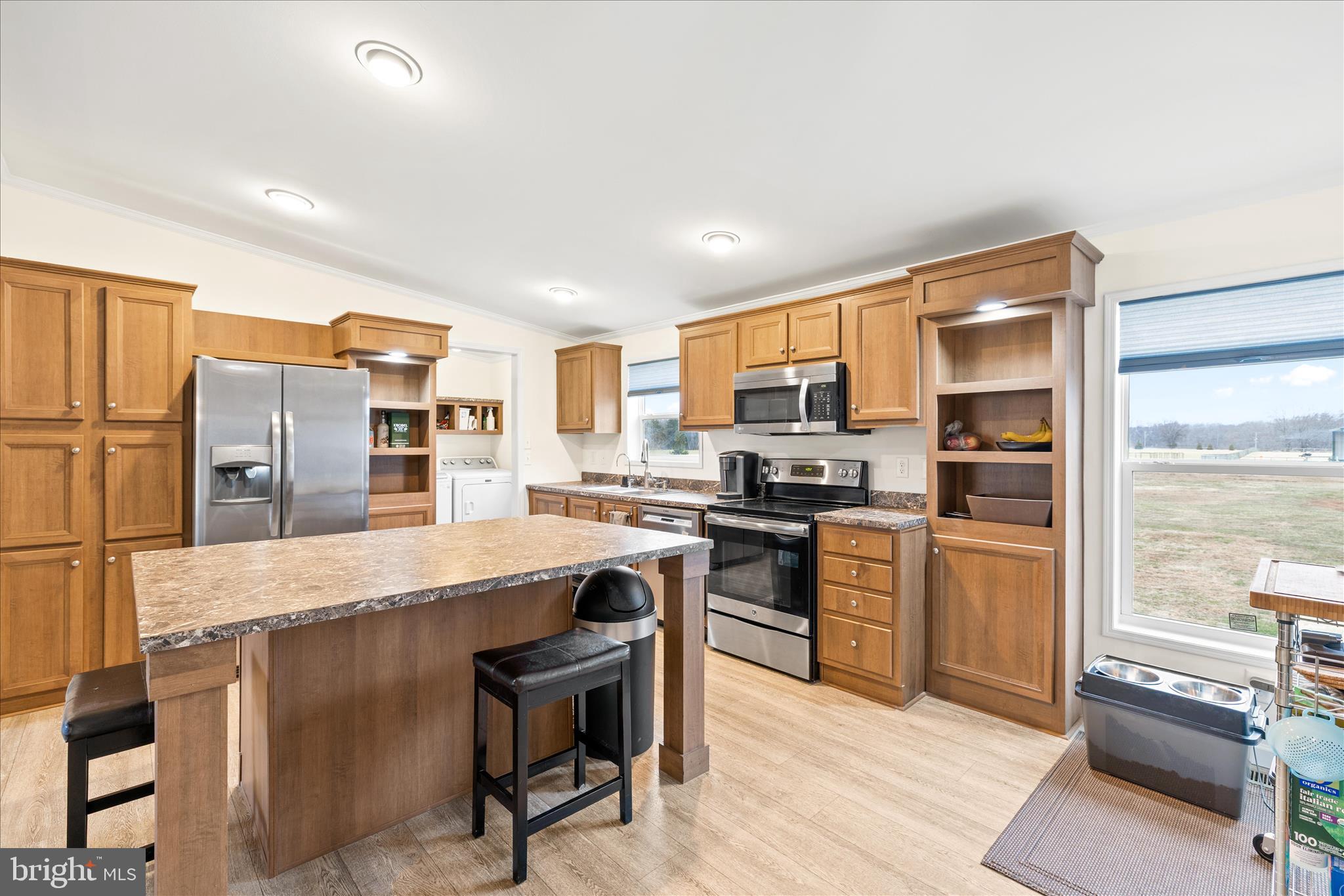 679 Oak Hill School Road Townsend, DE 19734 - Photo 10 of 50 a kitchen with stainless steel appliances granite countertop a refrigerator a stove top oven a sink dishwasher and white cabinets with wooden floor