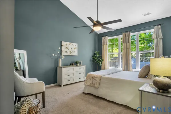 a bedroom with a bed and furniture
