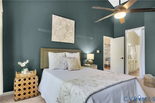 a bedroom with a bed and a lamp
