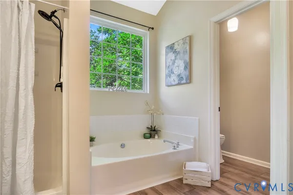 a white bath tub sitting next to a white sink