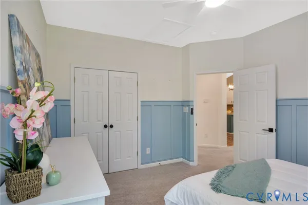 a bedroom with a bed and a couch