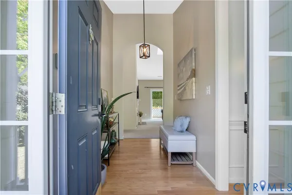 a living room with furniture and a gate