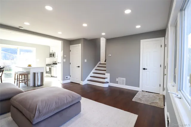 a spacious bedroom with a bed and a walk in closet