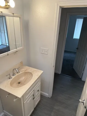 a bathroom with a sink and a mirror