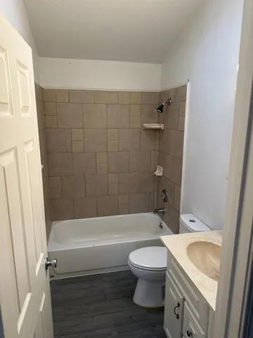 a bathroom with a sink a toilet and a bathtub