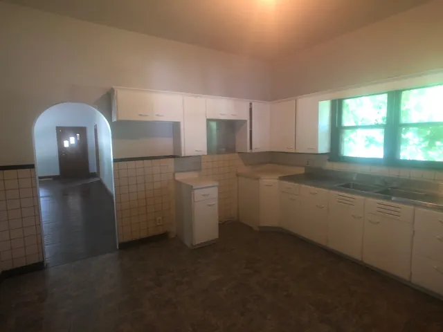 a kitchen with a sink and cabinets