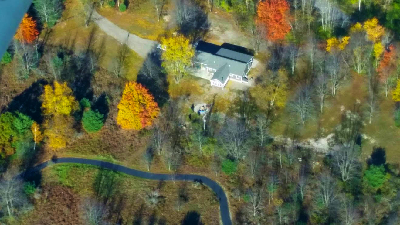 8980 Bayview Road Onekama, MI 49675 - Photo 44 of 45 Areal View of Cottage in Fall