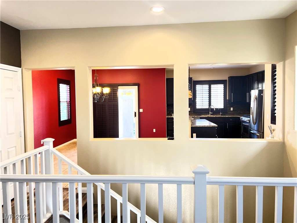 9535 Leaping Lizard Street Las Vegas, NV 89178 - Photo 13 of 37 View from second floor living room into kitchen/dining area