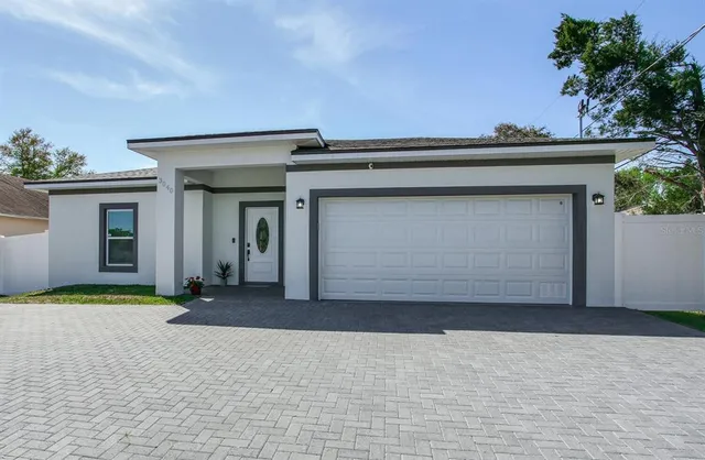 a front view of a house with a garage